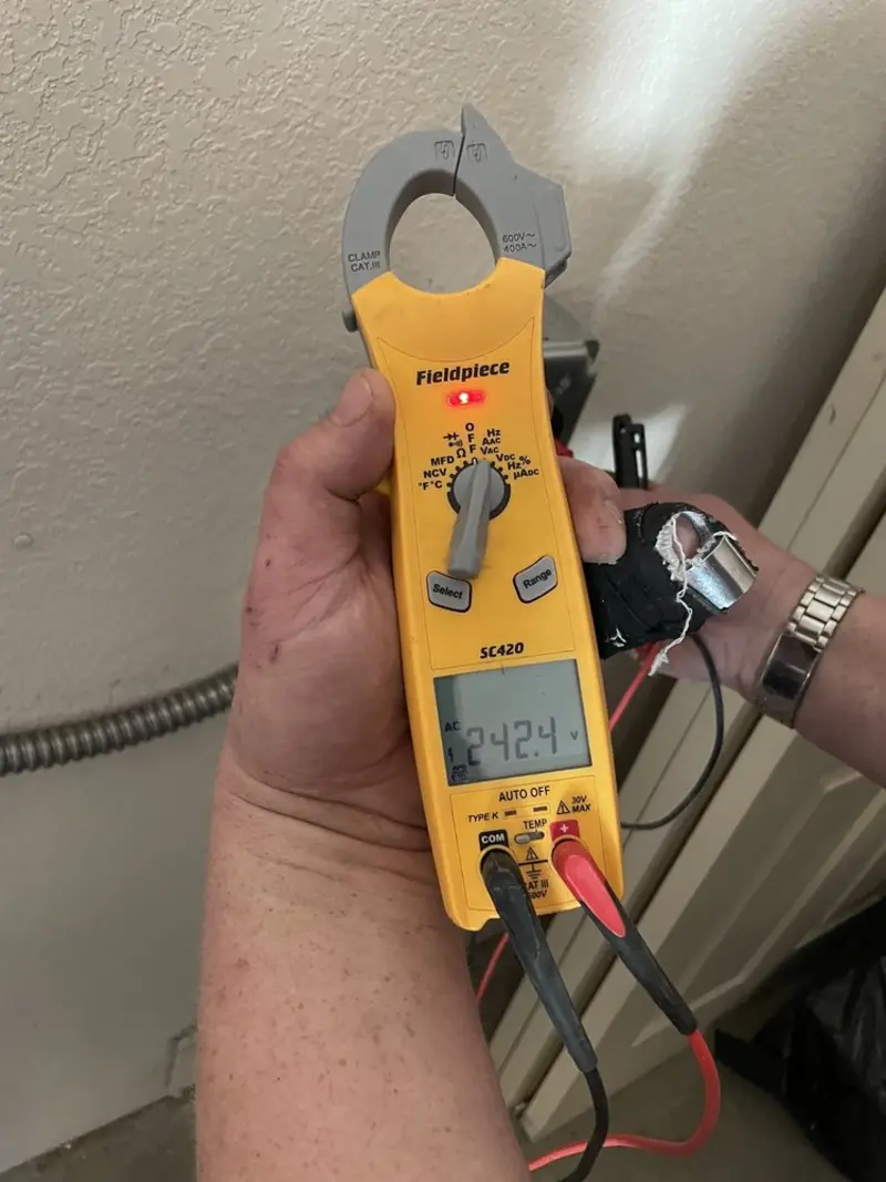 Voltage testing with clamp meter during Electrical Installation Services in Radford
